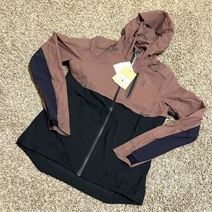 on running women’s weather jacket color is grape and black size is a small